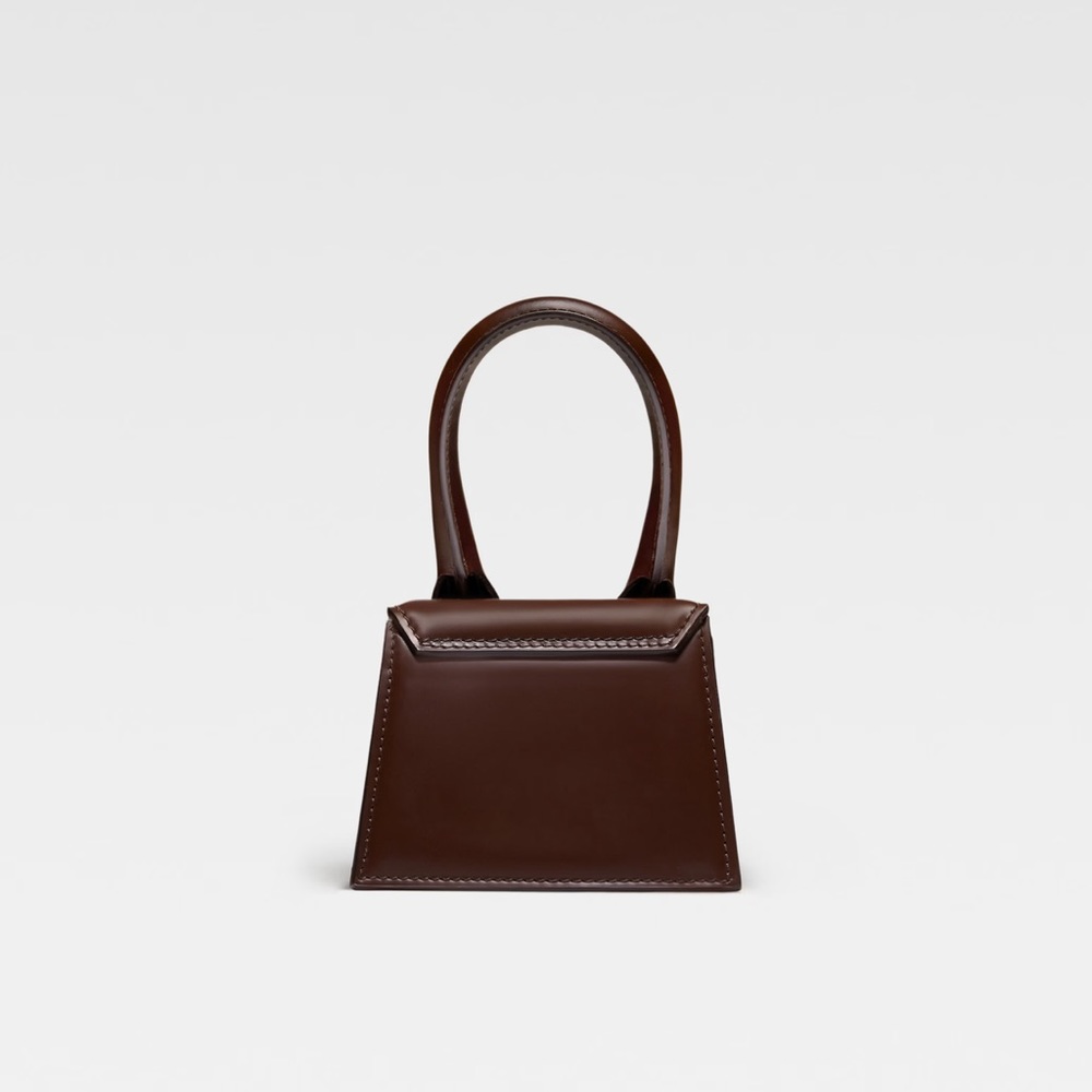 LE RAPHIA
Signature leather mini handbag.

Le Chiquito - Picture 3 of 5